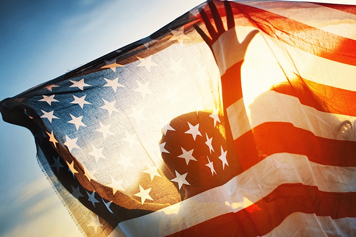 person carrying american flag