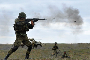 soldier shooting a gun